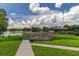 Community dock and gazebo overlooking a serene lake offers outdoor space and scenic view at 7410 E Bank Dr, Tampa, FL 33617