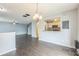 Open-concept living space flows into the kitchen and stairs, great for entertaining guests at 7410 E Bank Dr, Tampa, FL 33617