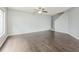 Large living room with light gray paint and dark floors, with staircase on one side at 7410 E Bank Dr, Tampa, FL 33617