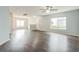 Spacious living room with natural light, complemented by dark wood-look floors at 7410 E Bank Dr, Tampa, FL 33617