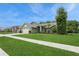Side view of a single-story home featuring manicured lawn, and trimmed bushes at 8549 Pinafore Dr, New Port Richey, FL 34653