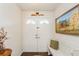 Warm foyer with double doors, bench, and a charming country-style decor and wood flooring at 8549 Pinafore Dr, New Port Richey, FL 34653