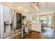 Modern kitchen featuring stainless steel appliances, white cabinets, and an eat-in kitchen at 8549 Pinafore Dr, New Port Richey, FL 34653