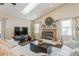 Living room features a vaulted ceiling, sky light, brick fireplace, and neutral color palette at 8549 Pinafore Dr, New Port Richey, FL 34653