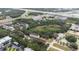 Aerial view showcasing the property, including the building, parking, and surrounding lush greenery at 962 Sombra St, Tampa, FL 33619