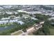 Aerial view of a complex featuring several buildings, a pond with a fountain, and retail in background at 962 Sombra St, Tampa, FL 33619
