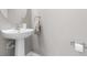 Modern half bathroom featuring stylish fixtures and a decorative mirror at 962 Sombra St, Tampa, FL 33619