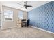 Bright bedroom with carpet, windows, ceiling fan, and a desk at 962 Sombra St, Tampa, FL 33619