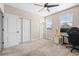 Bright bedroom with carpet, windows, ceiling fan, and a desk at 962 Sombra St, Tampa, FL 33619