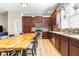 Kitchen featuring wood cabinets, stainless steel appliances, and ample counter space at 962 Sombra St, Tampa, FL 33619