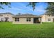 A spacious lawn surrounds the house with ample room for outdoor activities at 9724 Troncais Cir, Thonotosassa, FL 33592