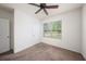 A bedroom featuring carpet, a ceiling fan, and a bright window at 9724 Troncais Cir, Thonotosassa, FL 33592