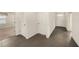 Open entryway featuring modern tile flooring and a view of the bright, carpeted living area at 9724 Troncais Cir, Thonotosassa, FL 33592