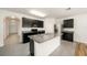 Bright kitchen boasts gray countertops, stainless steel appliances, and ample cabinet space at 9724 Troncais Cir, Thonotosassa, FL 33592