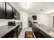 This modern kitchen boasts granite countertops, stainless steel appliances and ample cabinet space at 9724 Troncais Cir, Thonotosassa, FL 33592