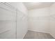 A walk-in closet with carpet and shelving at 9724 Troncais Cir, Thonotosassa, FL 33592