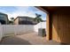 Cozy back patio area enclosed with white fencing, providing privacy and outdoor enjoyment at 9752 Trumpet Vine Loop, Trinity, FL 34655