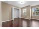 Bedroom with windows providing plenty of natural light and a large double door closet at 9752 Trumpet Vine Loop, Trinity, FL 34655