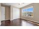 This bedroom offers great natural light from its window and features hardwood floors and a large closet at 9752 Trumpet Vine Loop, Trinity, FL 34655