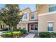 Charming townhome entrance with lush greenery and a well-lit pathway at 9752 Trumpet Vine Loop, Trinity, FL 34655