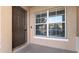 Inviting front entrance featuring a stylish door and bright window, enhanced by brick pavers at 9752 Trumpet Vine Loop, Trinity, FL 34655