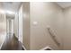 Hallway with hardwood floors leading to multiple rooms at 9752 Trumpet Vine Loop, Trinity, FL 34655