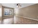 Bright living area featuring neutral walls and large windows at 9752 Trumpet Vine Loop, Trinity, FL 34655