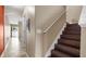 Staircase with wood steps and neutral walls; tiled flooring at 9752 Trumpet Vine Loop, Trinity, FL 34655