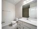 A well-lit bathroom with a large mirror and modern fixtures at 10347 Heron Hideaway Loop, Land O Lakes, FL 34638
