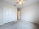 Cozy bedroom with a ceiling fan and closet doors at 10347 Heron Hideaway Loop, Land O Lakes, FL 34638