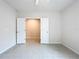 This bright bedroom features tile flooring and neutral paint at 10347 Heron Hideaway Loop, Land O Lakes, FL 34638