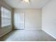 An empty bedroom with a window and closet at 10347 Heron Hideaway Loop, Land O Lakes, FL 34638