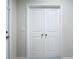 A pair of white closet doors enhance the interior design at 10347 Heron Hideaway Loop, Land O Lakes, FL 34638