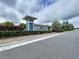 Community entrance to Cypress Preserve with landscaping, signage, and paved road at 10347 Heron Hideaway Loop, Land O Lakes, FL 34638