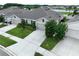 Aerial shot of a beautiful home with well-kept landscaping and a long driveway at 10347 Heron Hideaway Loop, Land O Lakes, FL 34638