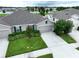 Charming single-story home featuring manicured lawn and a two-car garage at 10347 Heron Hideaway Loop, Land O Lakes, FL 34638