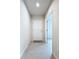 Inviting foyer featuring tile flooring, neutral walls, and a white front door at 10347 Heron Hideaway Loop, Land O Lakes, FL 34638