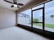 Screened lanai with a ceiling fan and views of backyard at 10347 Heron Hideaway Loop, Land O Lakes, FL 34638