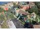 An aerial view of a townhouse complex featuring mature trees and landscaping, a pleasant place to live and play at 10412 White Lake Ct, Tampa, FL 33626