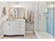 Charming bathroom with a glass door shower, vanity, and decorative mirror creates a spa-like retreat at 10412 White Lake Ct, Tampa, FL 33626