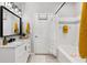 Well-lit bathroom featuring a vanity, a modern shower, and neutral decor, creating a soothing ambiance at 10412 White Lake Ct, Tampa, FL 33626