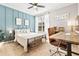 Serene bedroom with stylish decor, and a well-lit workspace at 10412 White Lake Ct, Tampa, FL 33626