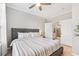 Relaxing bedroom with a plush bed and access to an ensuite bathroom with a glass door shower at 10412 White Lake Ct, Tampa, FL 33626
