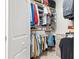 Well-organized walk-in closet with shelves, hanging rods, and ample storage space for clothing and accessories at 10412 White Lake Ct, Tampa, FL 33626