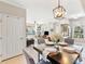 Elegant dining area with stylish lighting, and an open-concept design at 10412 White Lake Ct, Tampa, FL 33626