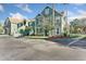 Attractive condo building featuring well-maintained landscaping and convenient parking at 10412 White Lake Ct, Tampa, FL 33626