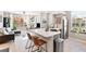 Modern kitchen with stainless steel appliances, quartz countertops, and ample cabinet space at 10412 White Lake Ct, Tampa, FL 33626