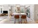 Open-concept kitchen featuring a large island with seating and sleek appliances at 10412 White Lake Ct, Tampa, FL 33626