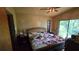 Bedroom with a large window and a queen bed at 1107 Goshen Rd, Tarpon Springs, FL 34689