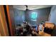Bedroom with a window, ceiling fan, and view of the home's interior, ready for personalization at 1107 Goshen Rd, Tarpon Springs, FL 34689